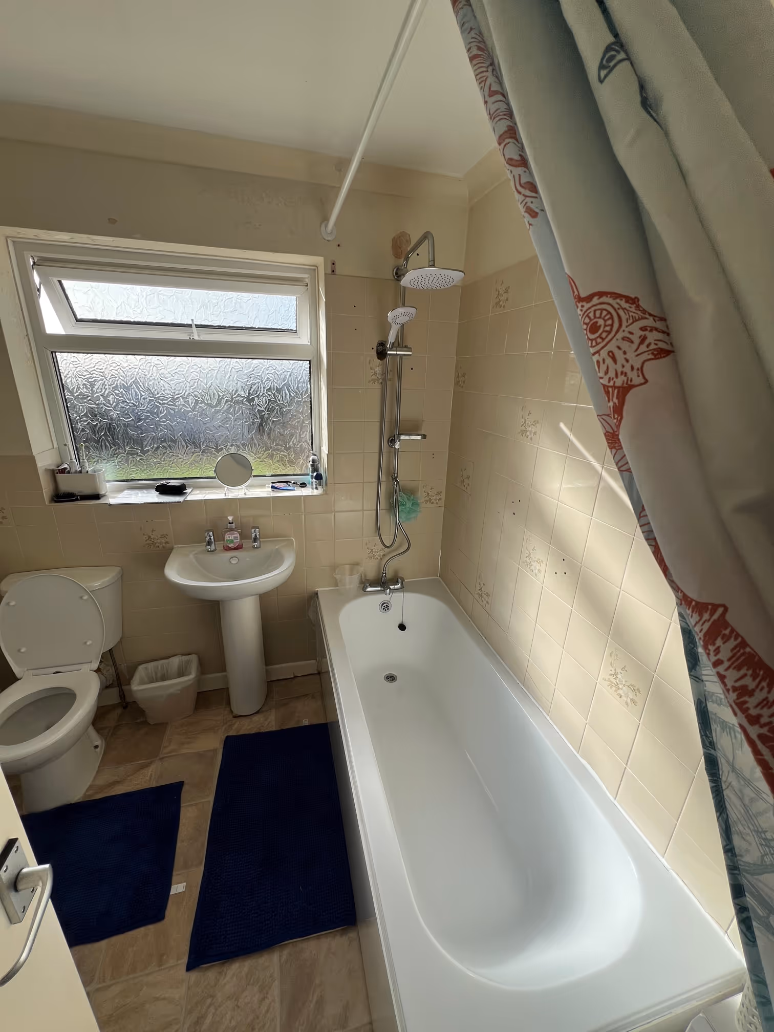Bathroom installation Teignmouth with modern vanity unit, toilet and wall panel finish