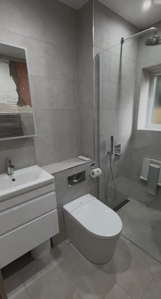 Modern wet room renovation in Paignton with linear drain and large format wall tiles