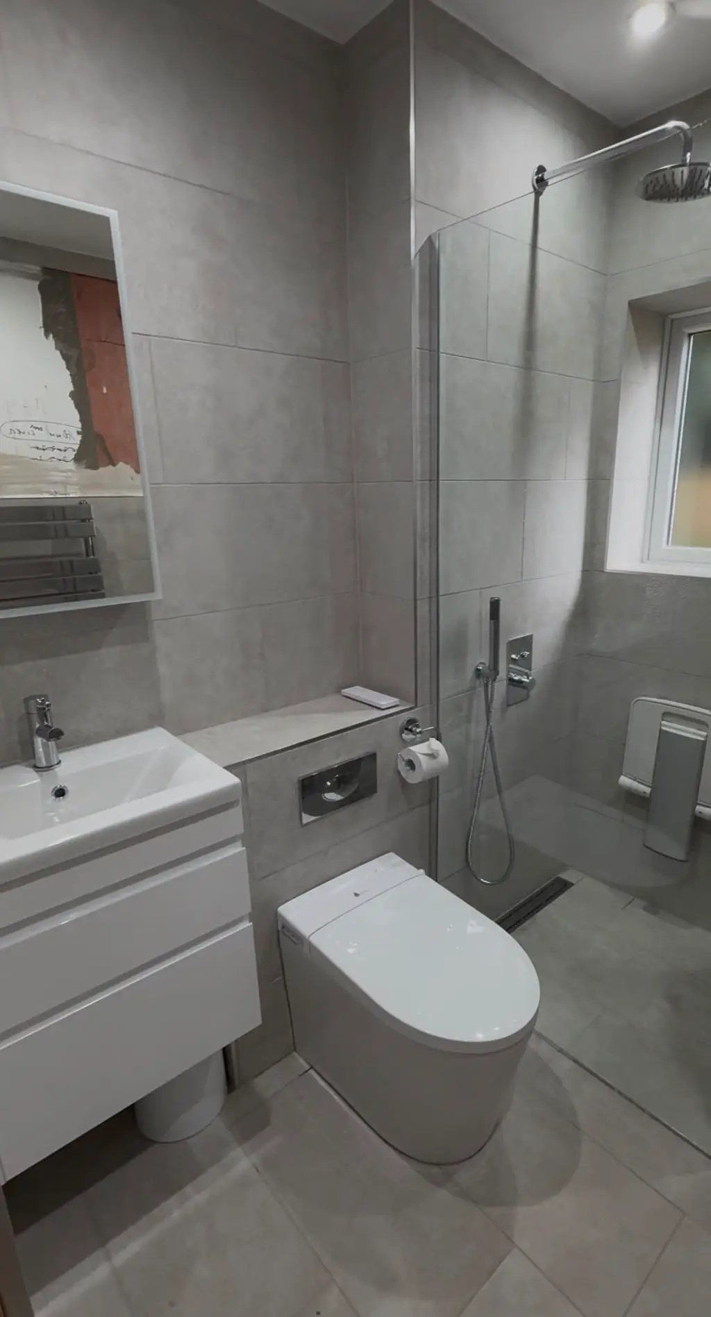 Modern wet room renovation in Paignton with linear drain and large format wall tiles